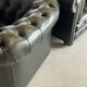 Title: Pair of vintage olive green leather Chesterfield armchairs