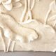 Bas-relief with flowers. Relief with flowers. Flowers in relief.