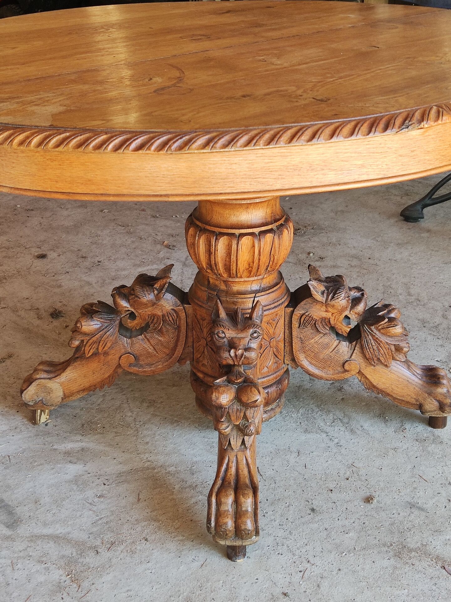 Oval oak table with carved details - known as a hunting table.