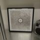 a Kinetic Op Art Aluchromy under glass frame.