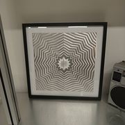 a Kinetic Op Art Aluchromy under glass frame.