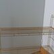 String shelf in golden metal wires