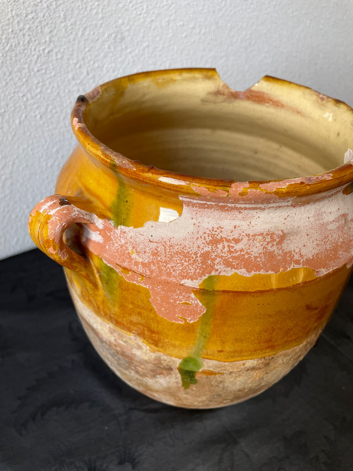 Old grease pot in glazed yellow terracotta, France nineteenth century