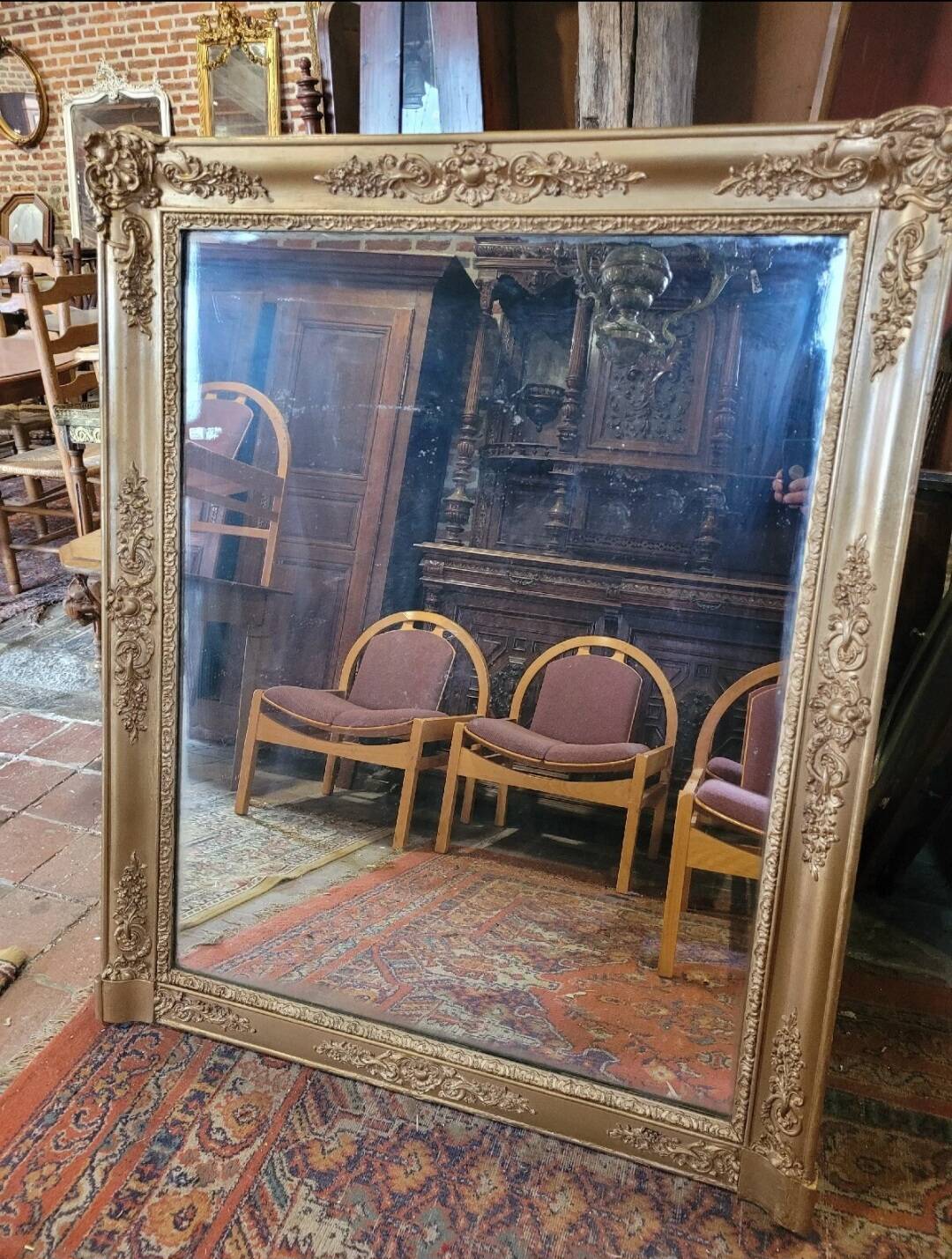 Antique gilded mirror from the 19th century, mercury mirror.