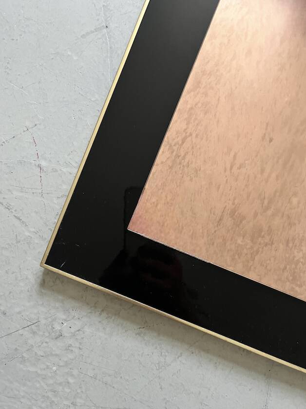 Large brass mirror and pink glass circa 1970