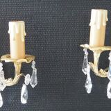 Pair of gilded bronze sconces and crystal pendants
