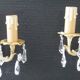 Pair of gilt bronze wall sconces with crystal pendants.