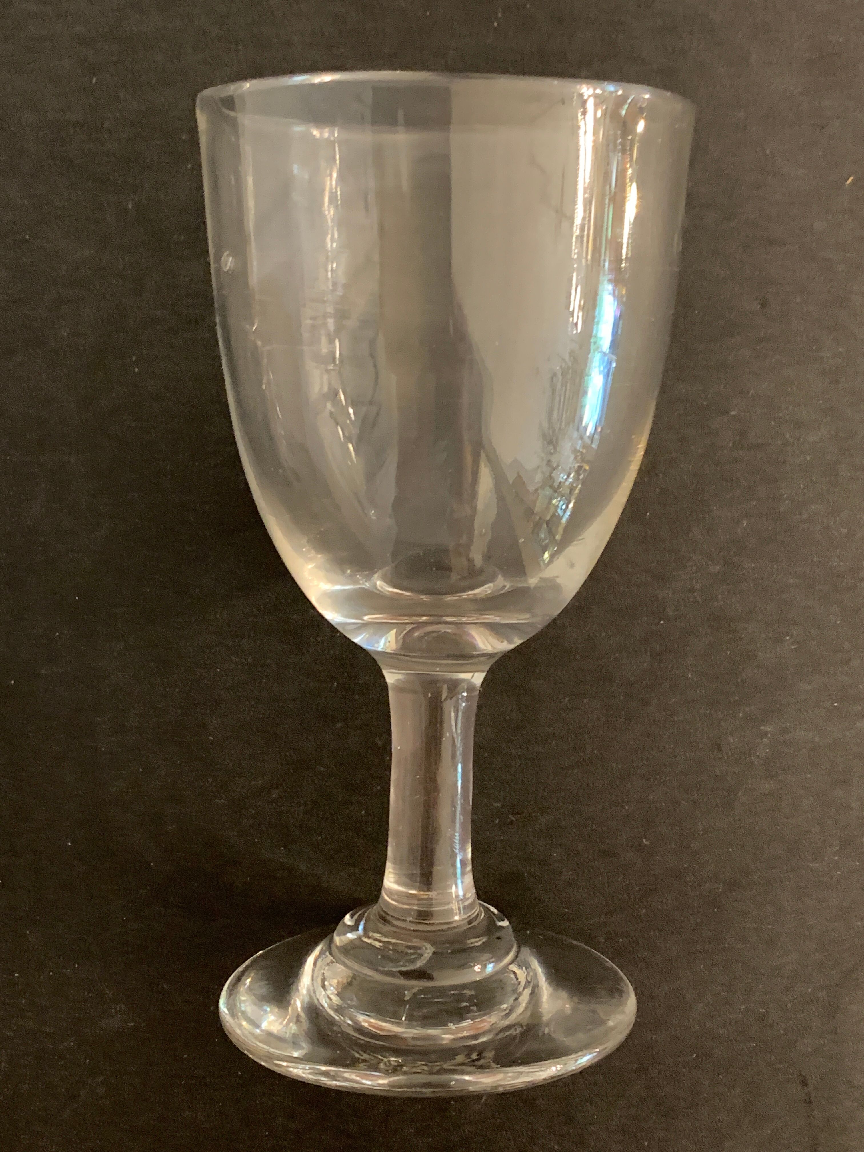 7 antique blown foot glasses