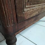 Bonnetière man standing cabinet a door