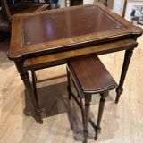Classic nesting tables in wood and leather.