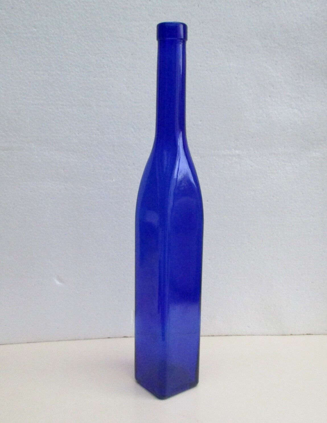 Blue glass bottle, square