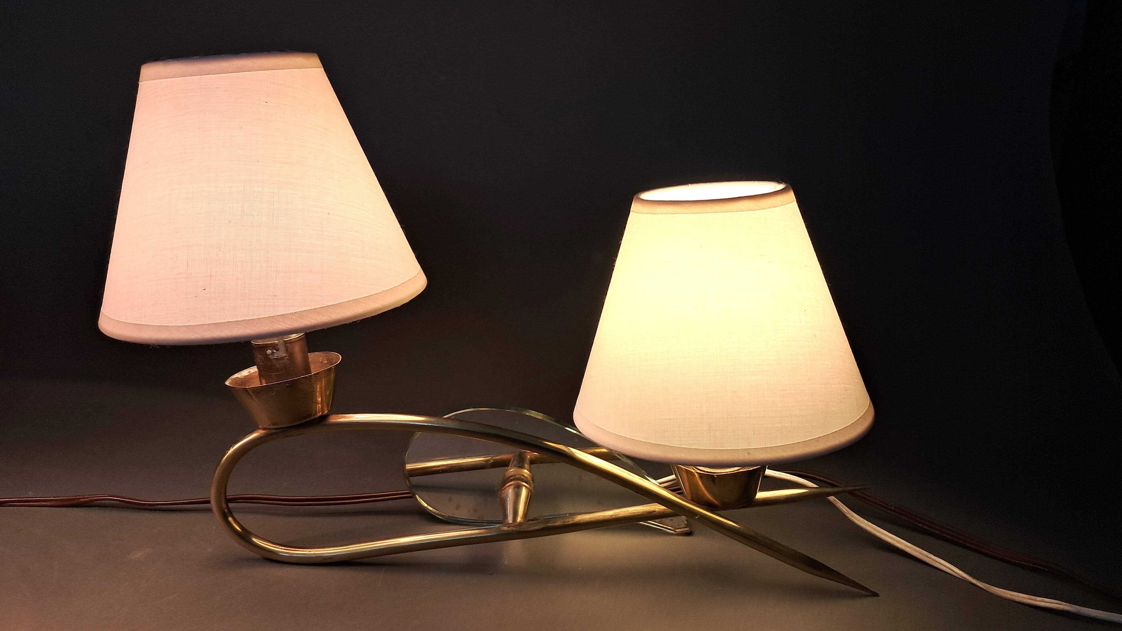 Pair of gilded brass and mirror wall lights, Circa 1960.