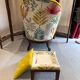 Upholstered toad armchair with footrest