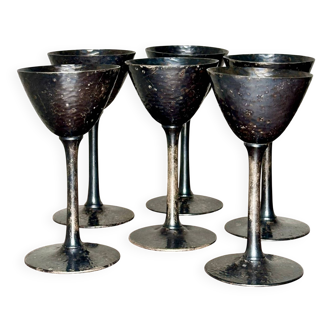 Set of six hammered metal goblets.