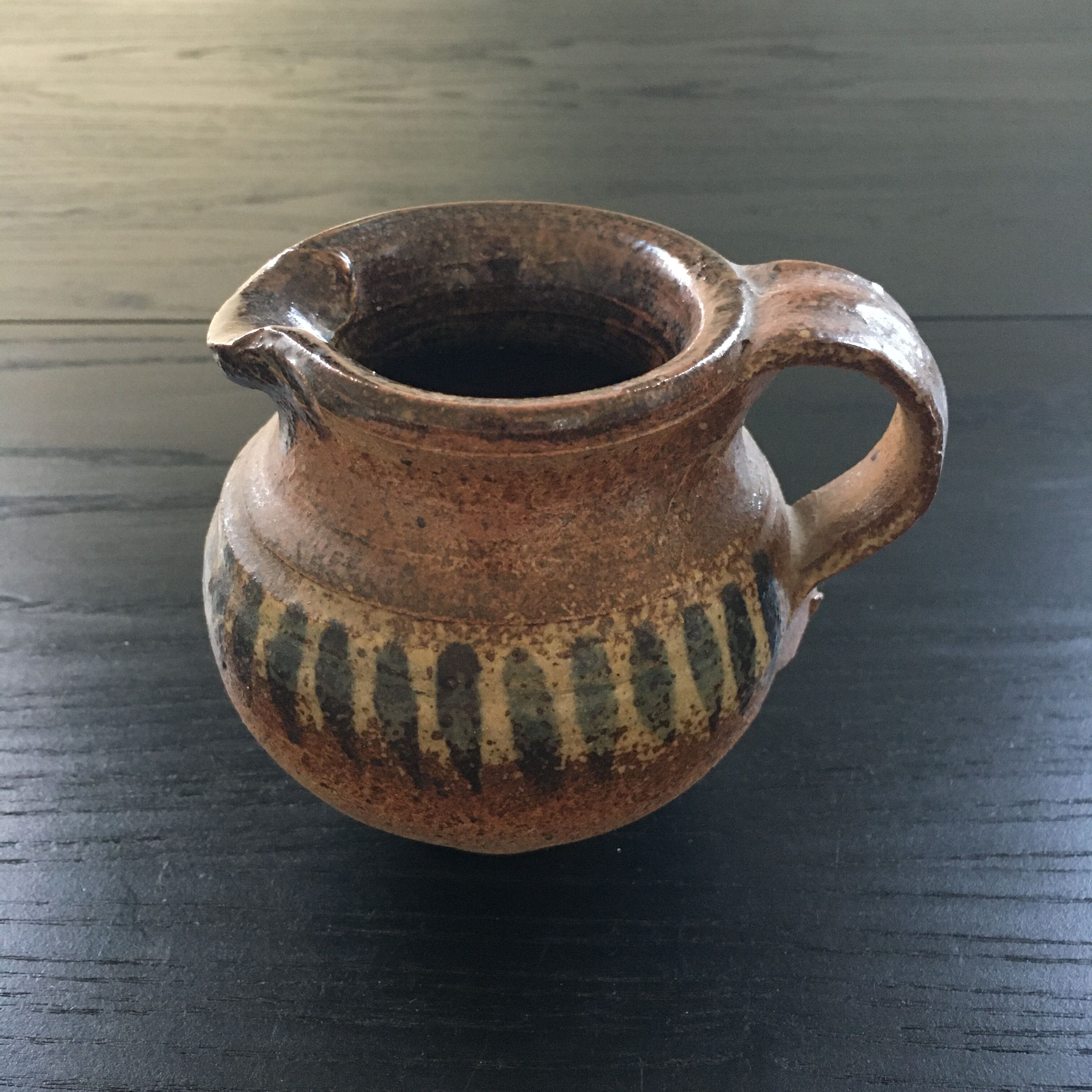 Stoneware pitcher with striped decoration
