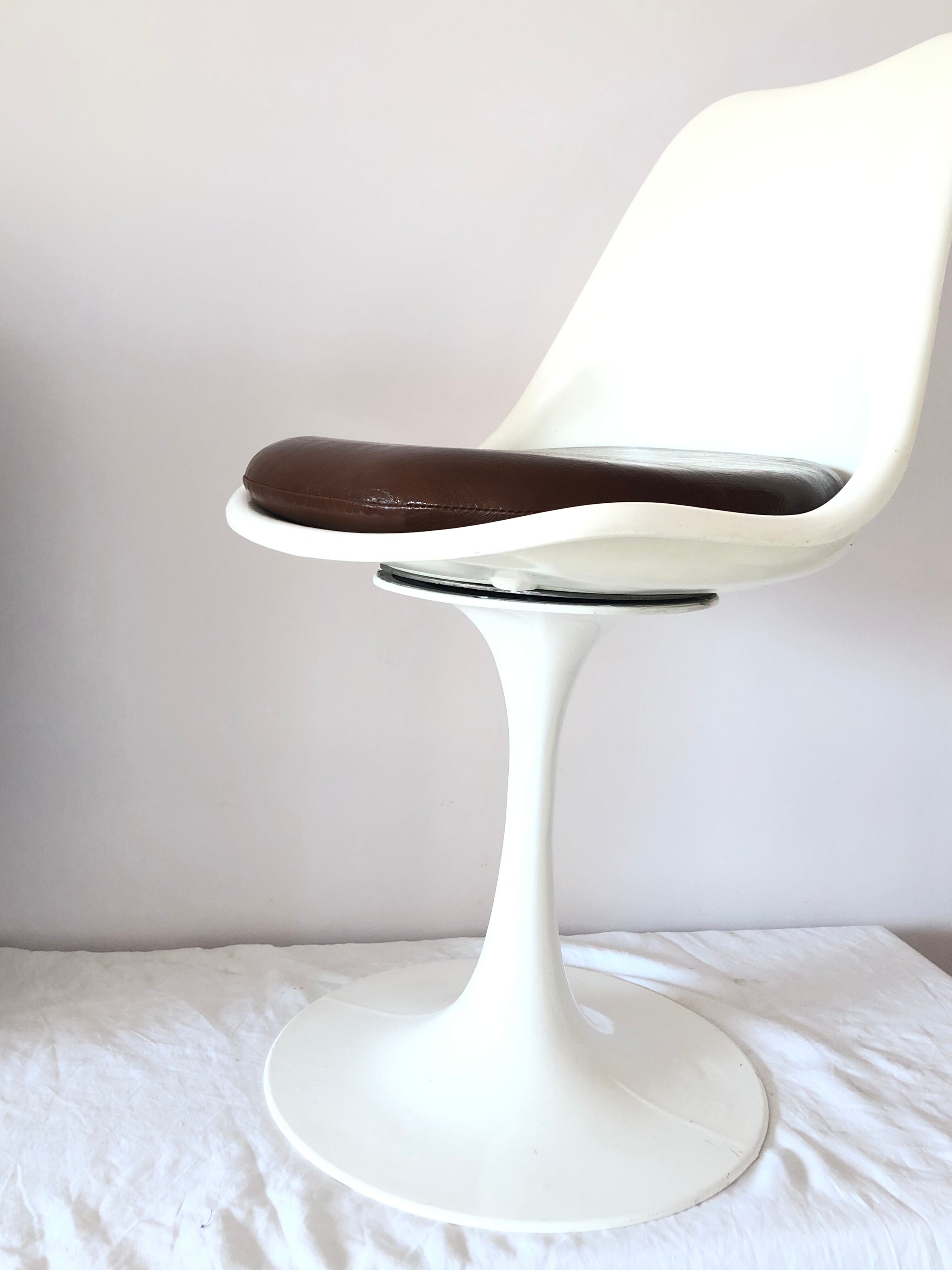 Pair of vintage tulip foot swivel chairs