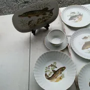 vintage porcelain dinner service with fish pattern and gold trim