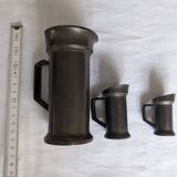 Set of small pewter measuring jugs