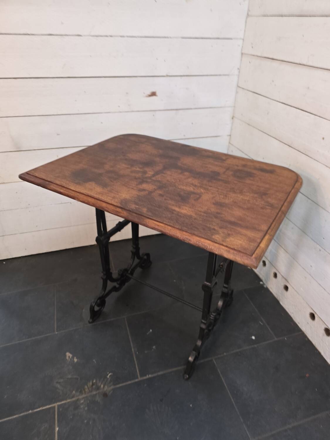 Bistro table with cast iron legs and oak top