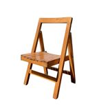 Old varnished wooden folding chair for children