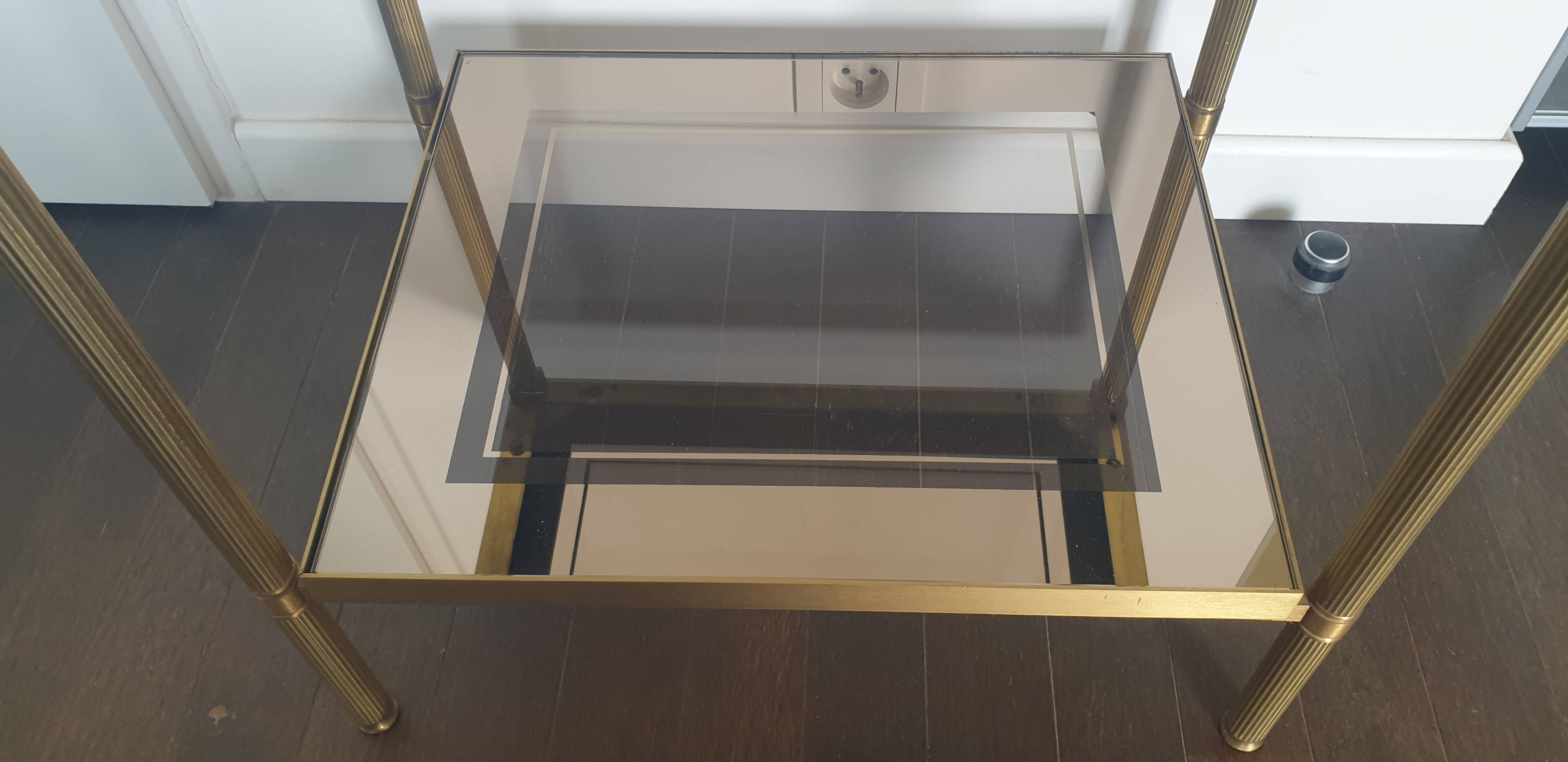 Double tray side table in brass and smoked glass.