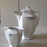 Old coffee maker and its milk pot