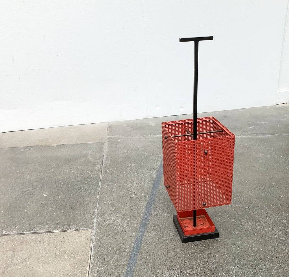 Minimalist perforated steel umbrella stand, 1960s