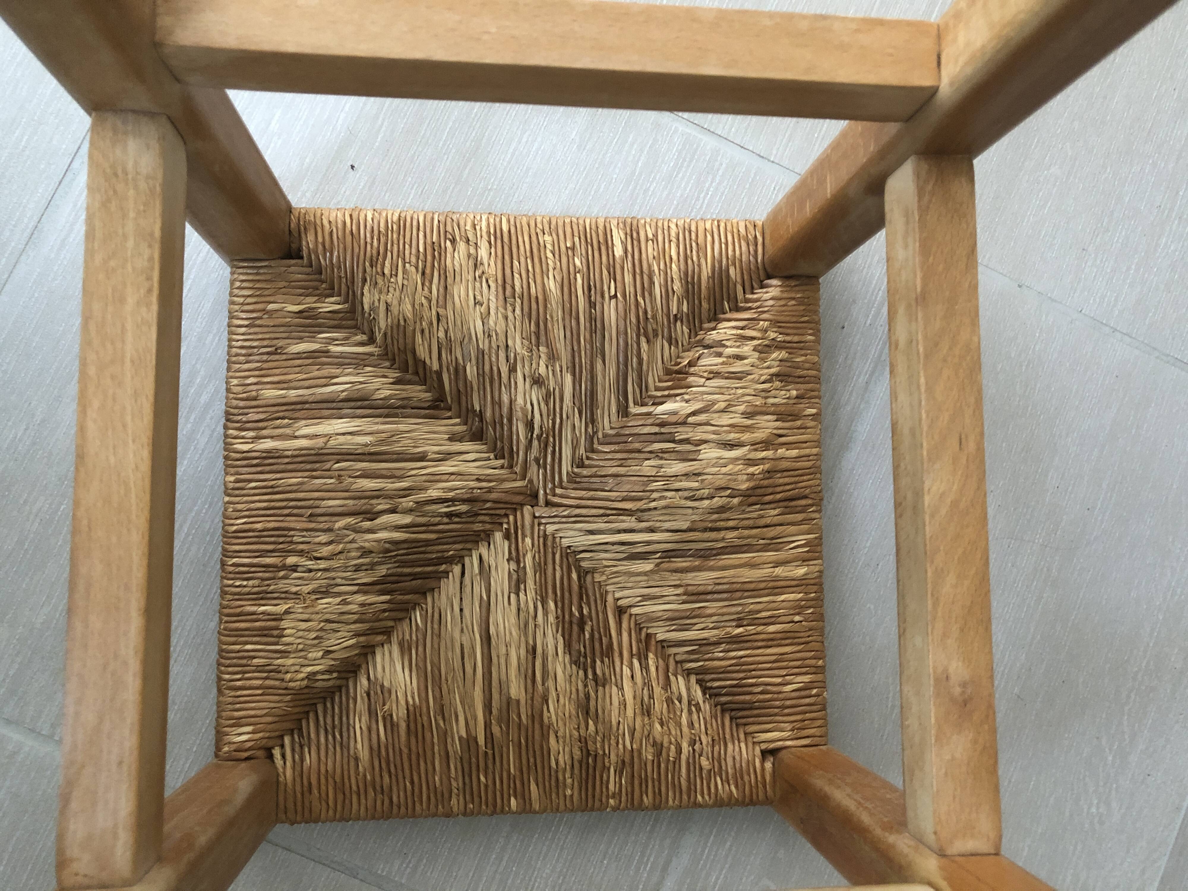 Wooden stool with straw seat