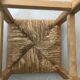 Wooden stool with straw seat