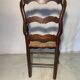 Antique Provencal armchair in carved wood with straw seat