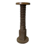 Old wooden press screw, round base