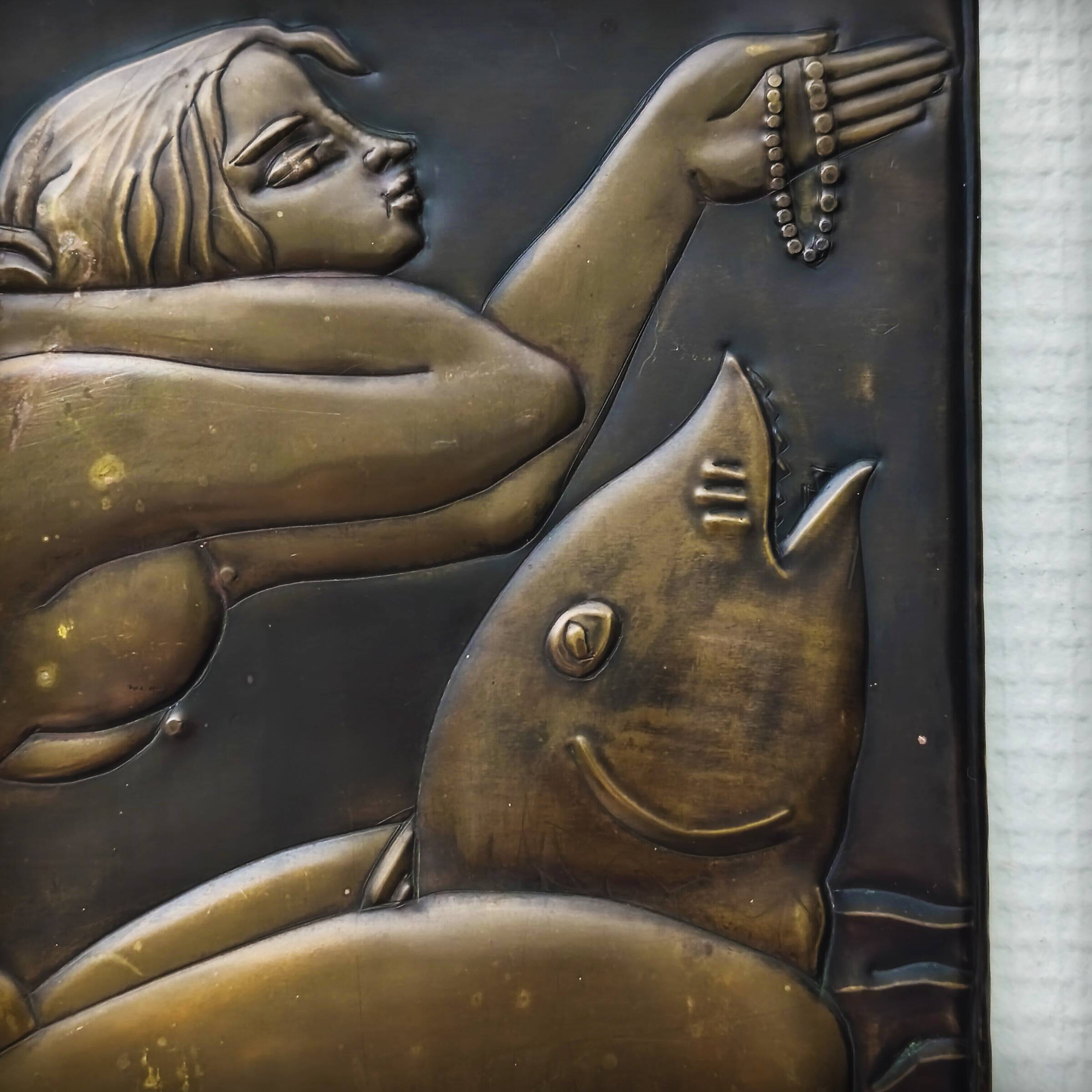 Brass table featuring a woman and a dolphin, France, 1960s.