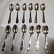 12 silver-plated metal teaspoons with a hallmark of 18.