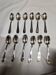 12 silver-plated metal teaspoons with a hallmark of 18.