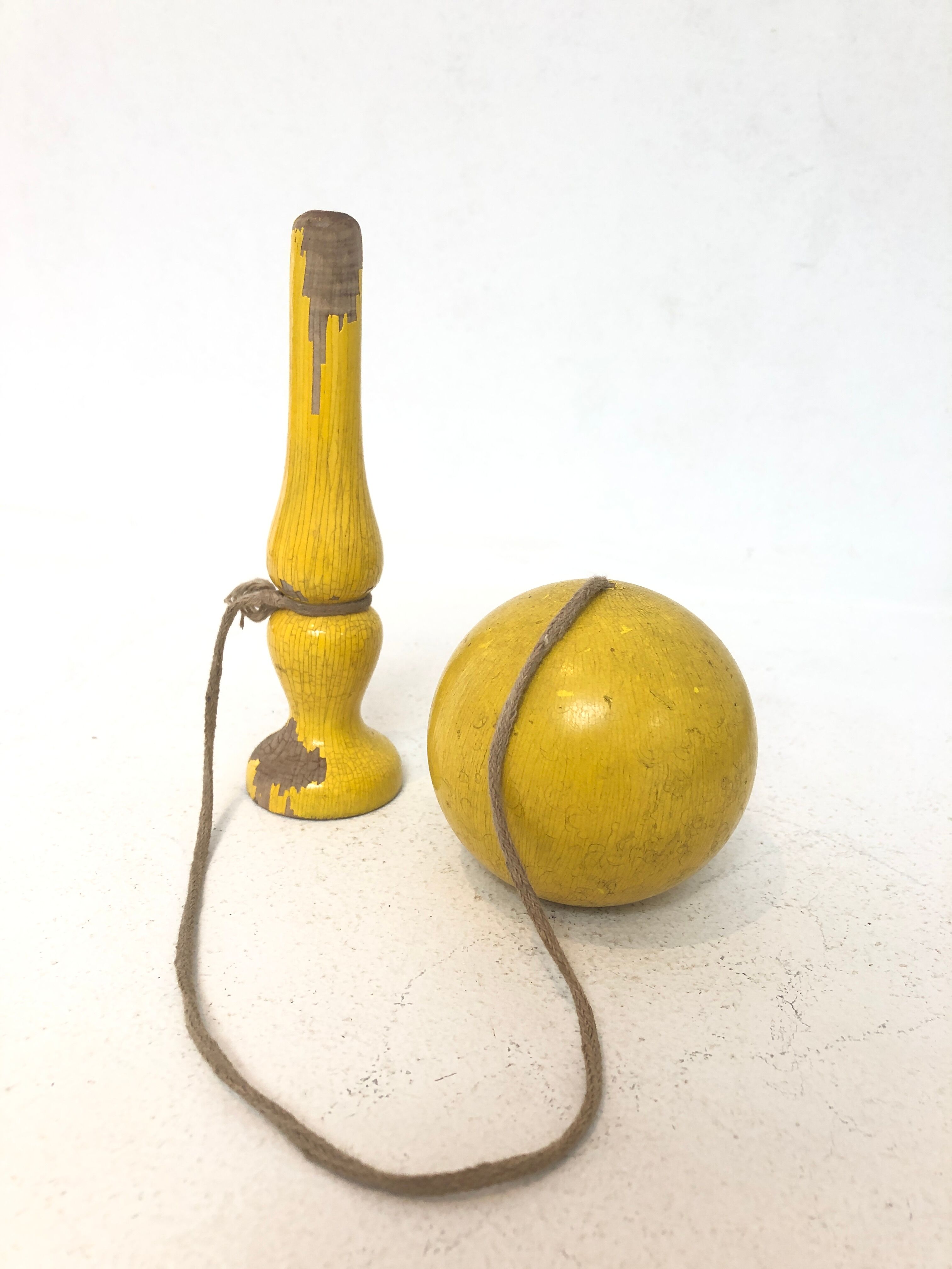 Vintage bilboquet in wood, yellow, 1960