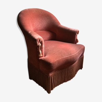 Fauteuil crapaud velours rose.