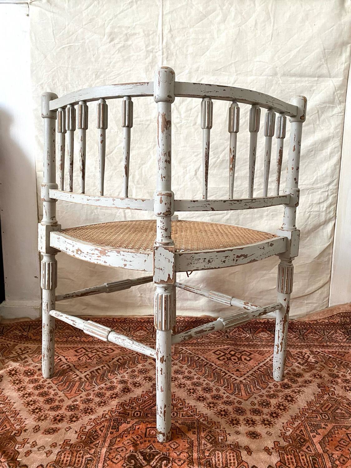 19th-century corner fireplace armchair, wood and cane.