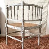 19th-century corner fireplace armchair, wood and cane.