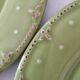 6 olive green plates with dotted relief, workshop ceramic style