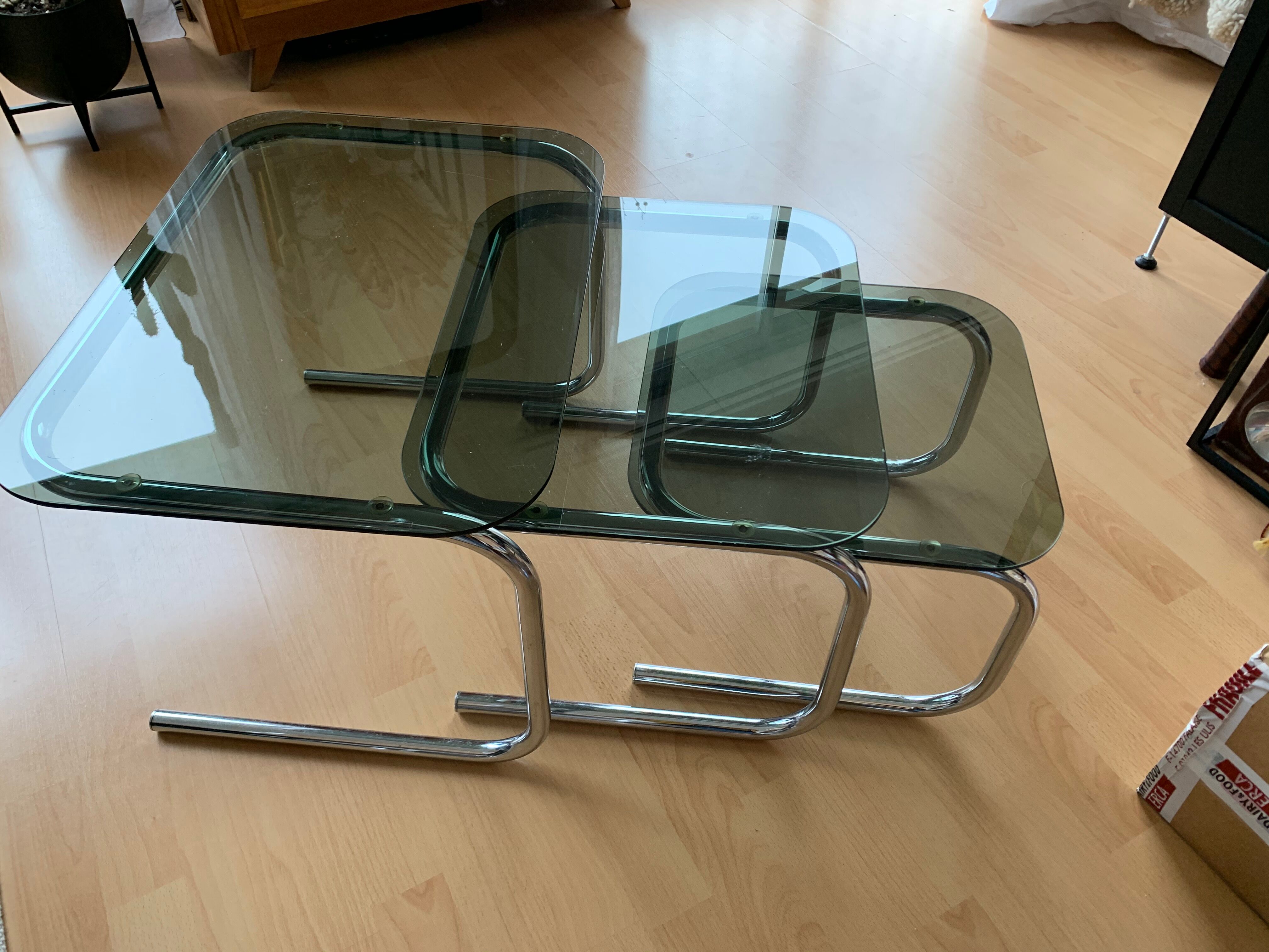 Pull out tables in chrome metal & smoked glass