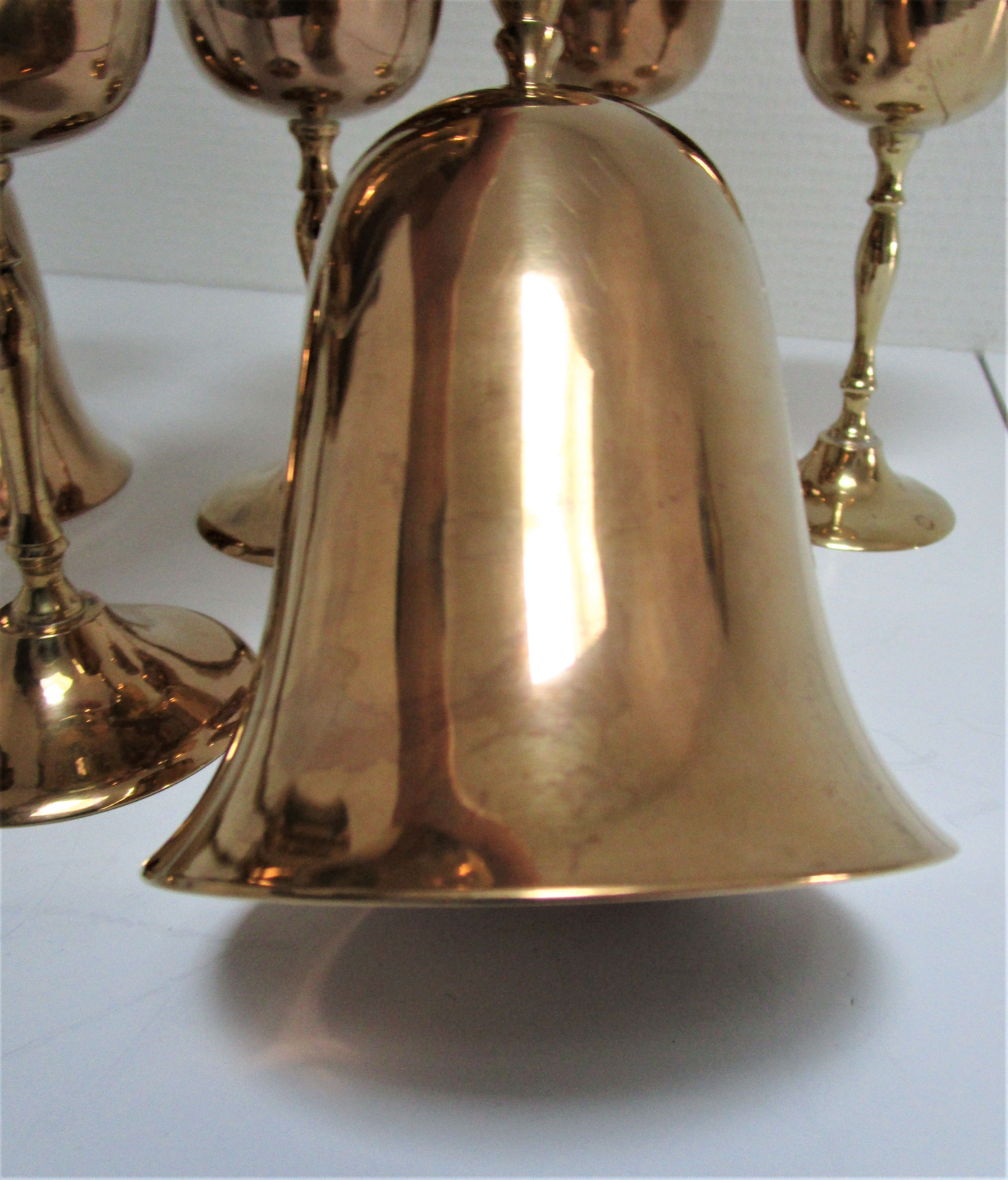 Set of eight vintage solid brass walking glasses