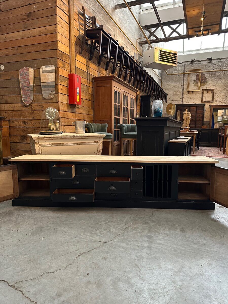 Old workshop furniture transformed into a TV unit.