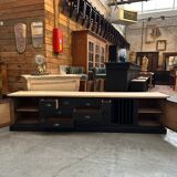 Old workshop furniture transformed into a TV unit.