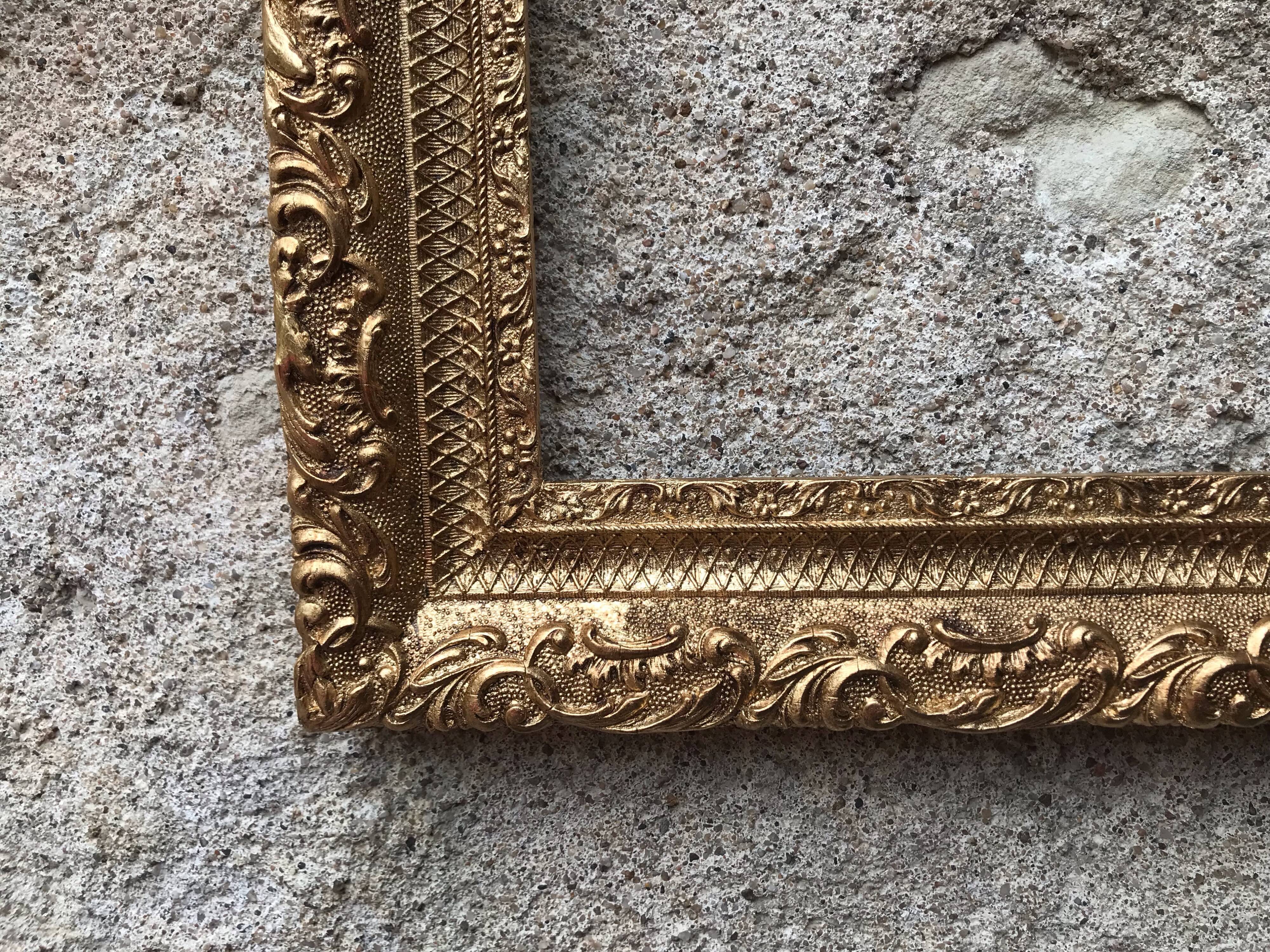 Old gilded frame with leaf