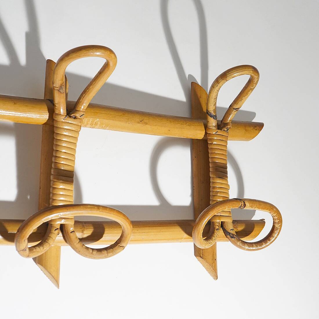 Wall coat rack in rattan and woven wicker, 1960s.