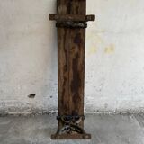 Dark brown wood and black cast-iron antique garden bench with weathered solid-wood seat