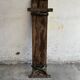 Dark brown wood and black cast-iron antique garden bench with weathered solid-wood seat