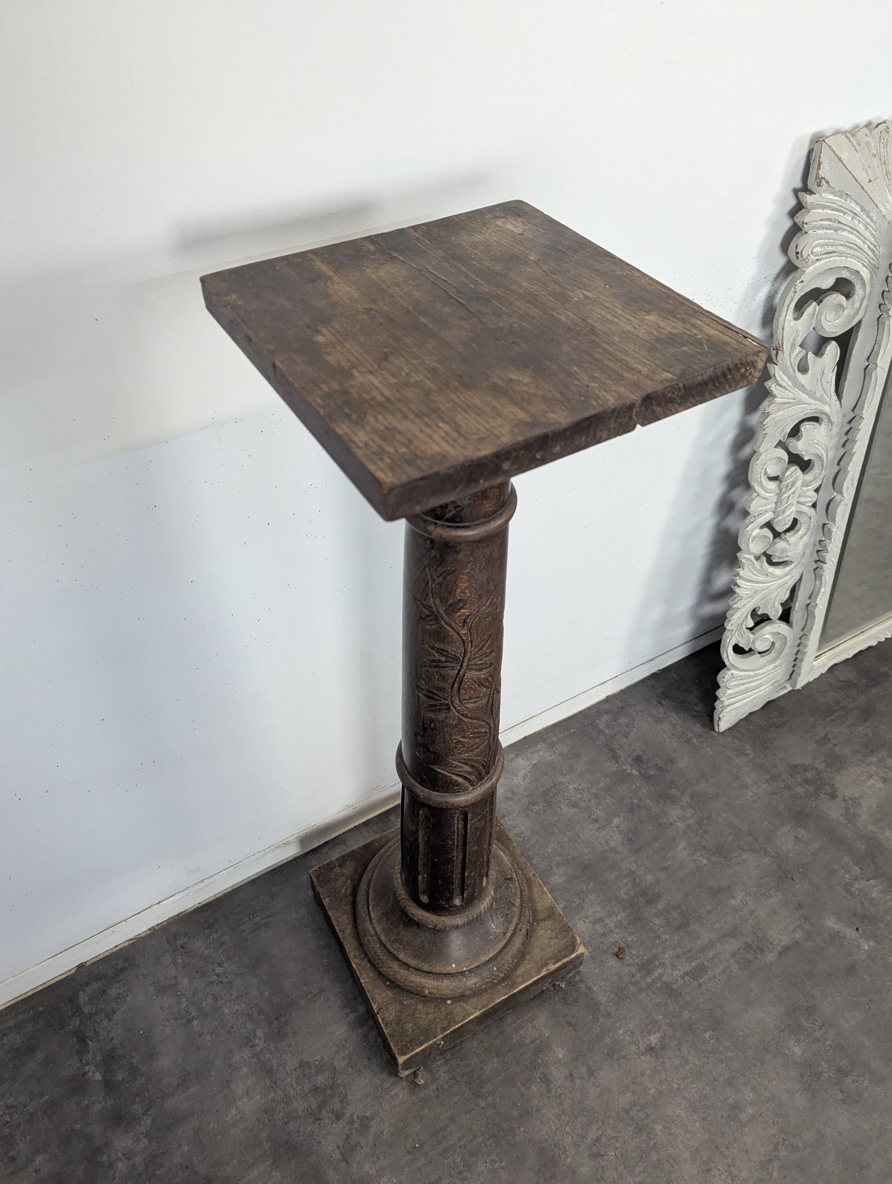 Fluted column side table in oak with a square top.