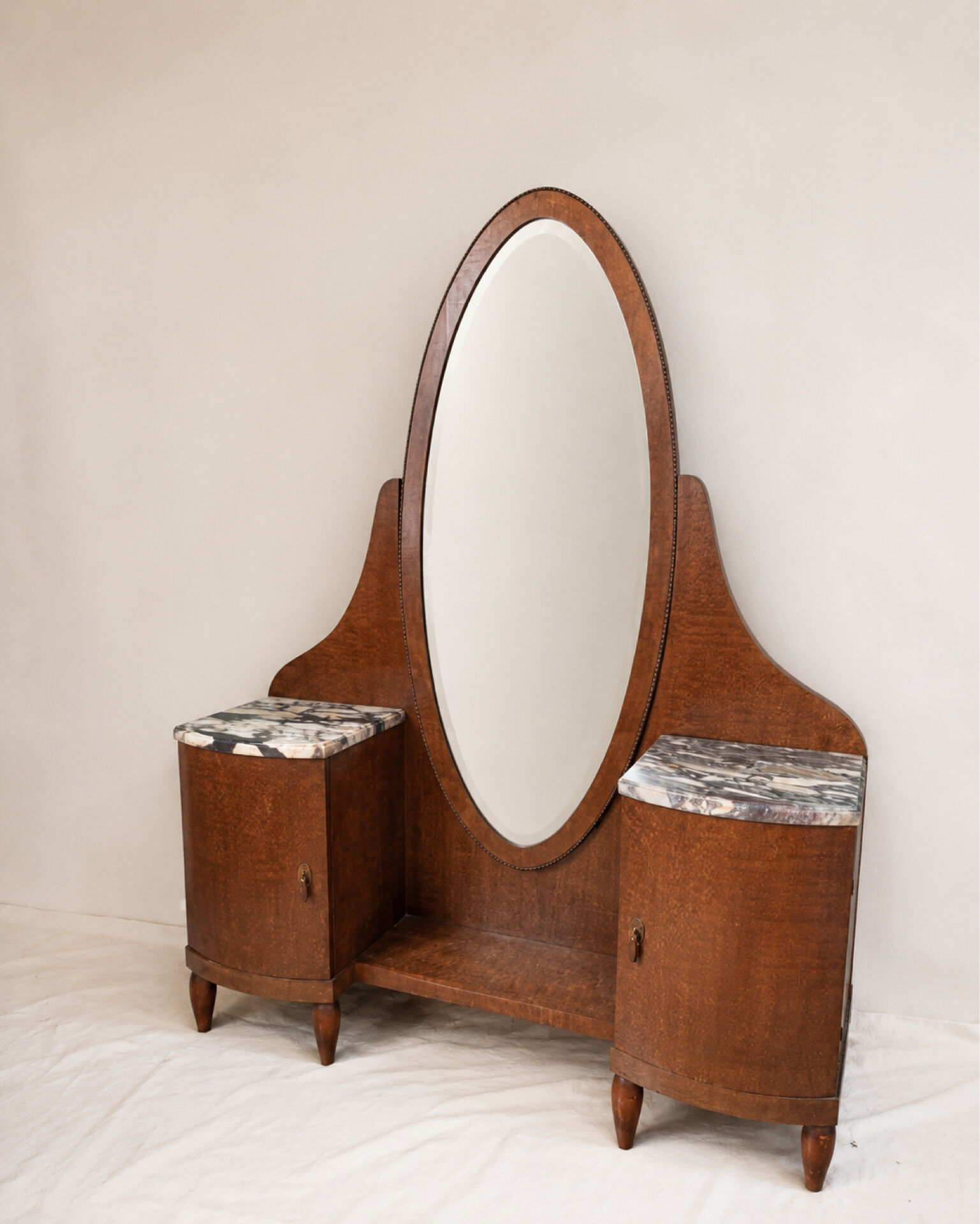 Art Deco dressing table in wood and marble, large oval mirror, 1930s-40s.