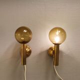 Set of solid brass wall lamps with smoked glass domes